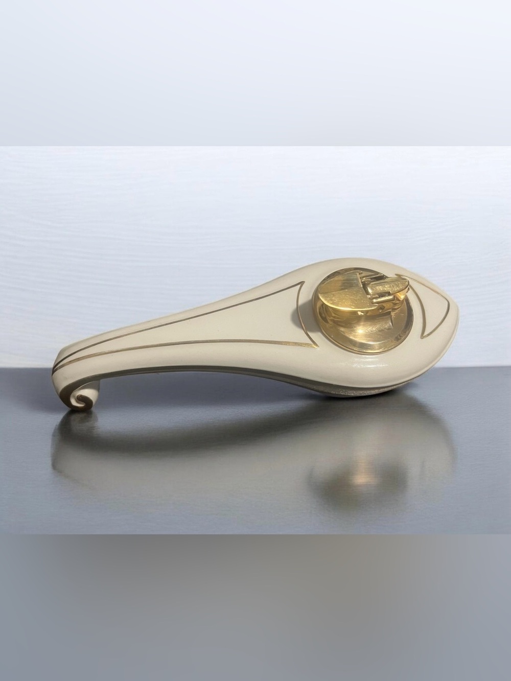 Vintage 1950s Ronson "Varaflame Fantasy" gold and white ceramic table lighter.